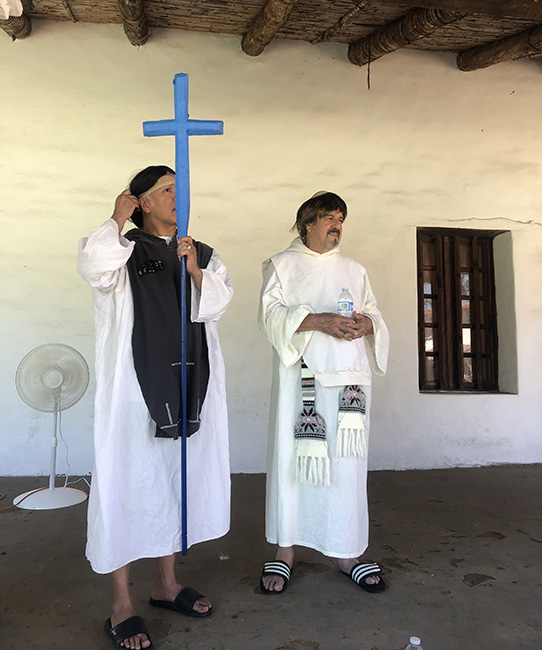 Gil and Luis, preparing to play the priest and acolyte.